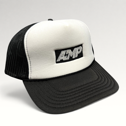 Raree Finds vintage AMP Any Means Possible trucker hat with a white foam front, black mesh back, and snapback closure.