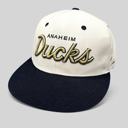 Raree Finds Anaheim Ducks Zephyr snapback hat with white crown, black brim, and gold raised script embroidery.