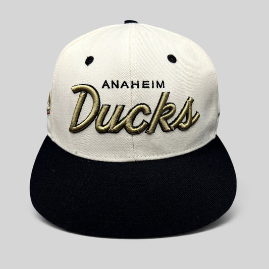 Raree Finds Anaheim Ducks Zephyr snapback hat with white crown, black brim, and raised gold script embroidery.