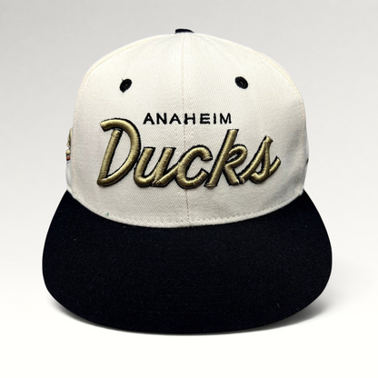 Raree Finds Anaheim Ducks Zephyr snapback hat with white crown, black brim, and raised gold script embroidery.