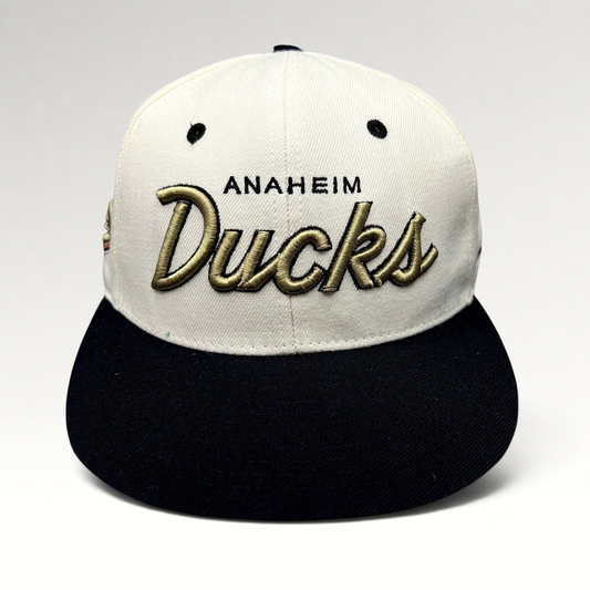 Raree Finds Anaheim Ducks Zephyr snapback hat with white crown, black brim, and raised gold script embroidery.