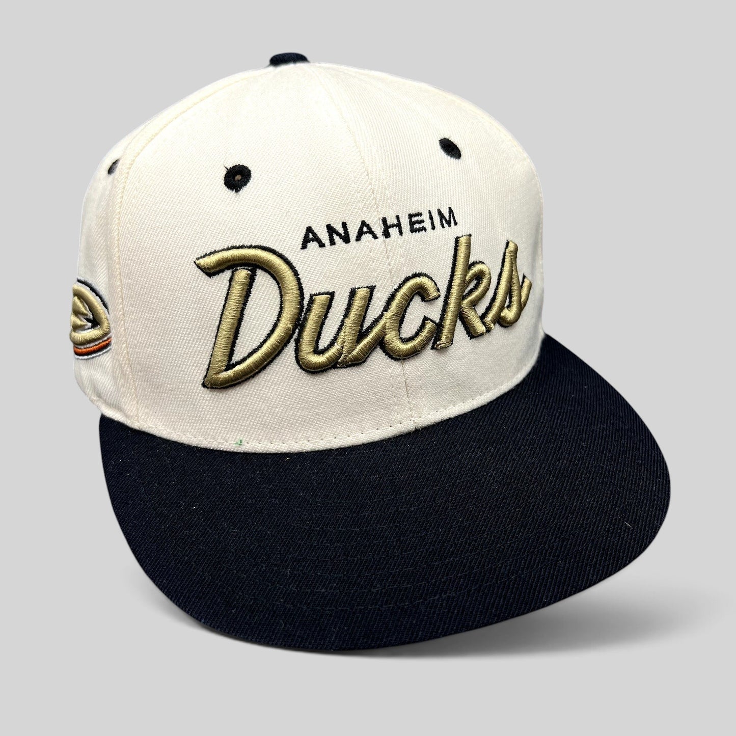 Raree Finds Anaheim Ducks Zephyr snapback hat with white crown, black brim, and gold raised script embroidery.