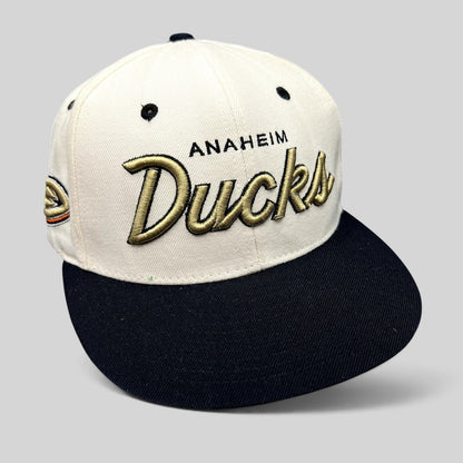 Raree Finds Anaheim Ducks Zephyr snapback hat with white crown, black brim, and gold raised script embroidery.