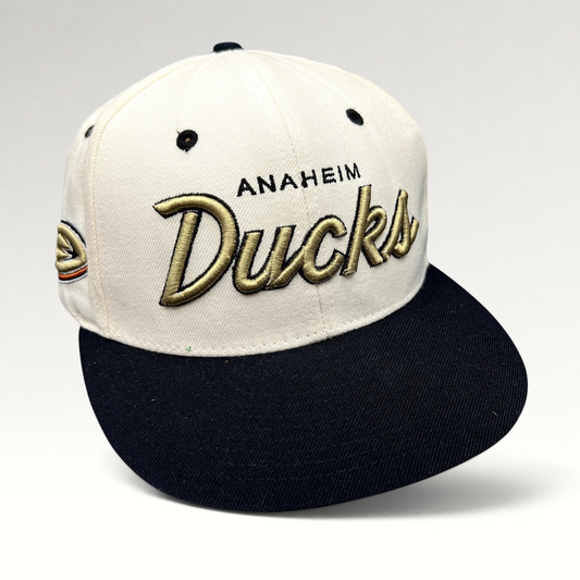 Raree Finds Anaheim Ducks Zephyr snapback hat with white crown, black brim, and gold raised script embroidery.