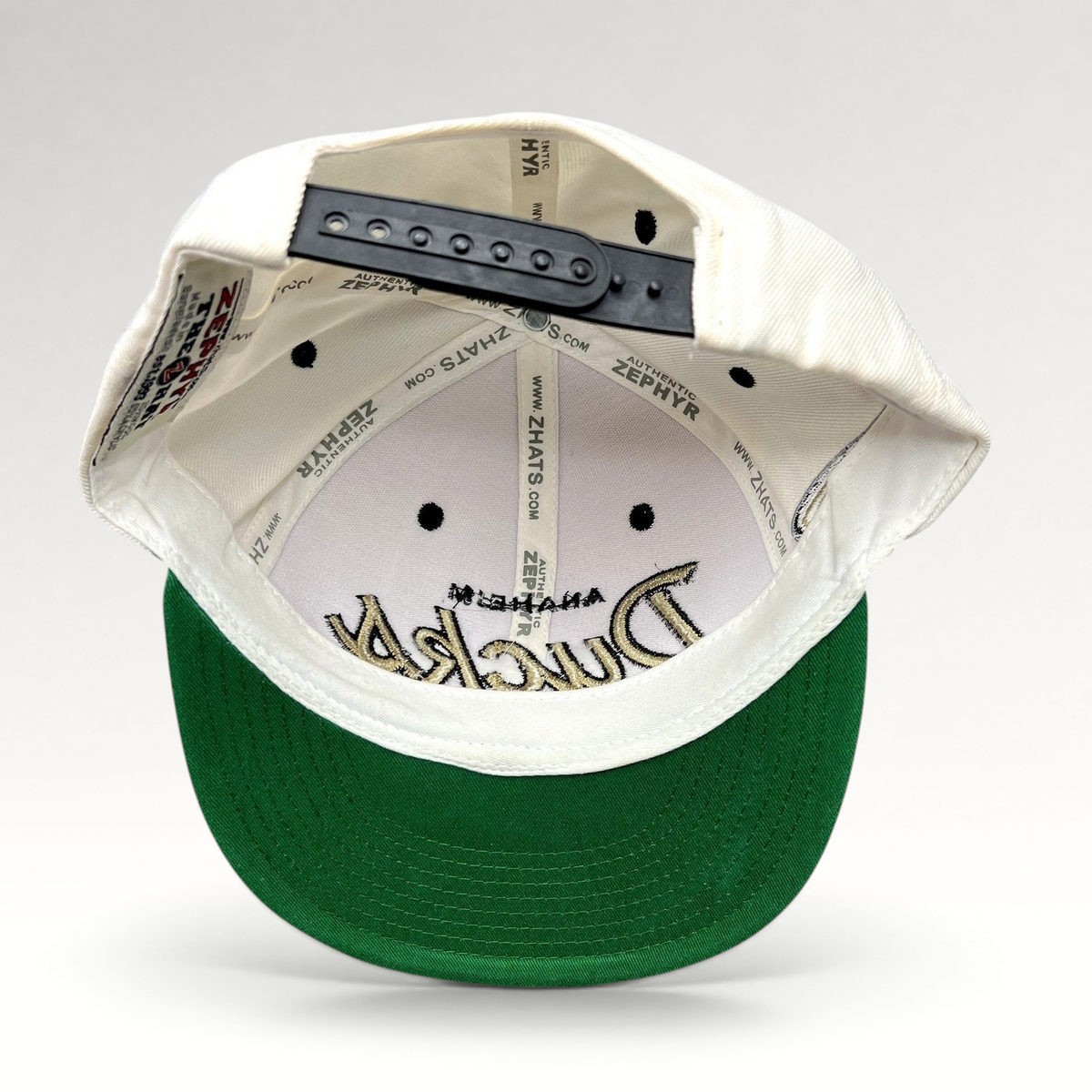 Raree Finds Anaheim Ducks Zephyr snapback hat interior view showing green undervisor and branded interior taping