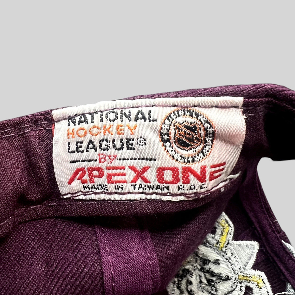 Raree Finds vintage Apex One Anaheim Mighty Ducks NHL cap interior tag showing National Hockey League branding.