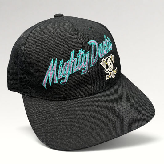 Raree Finds vintage Anaheim Mighty Ducks snapback hat in black with teal and purple script logo and Wild Wing emblem.