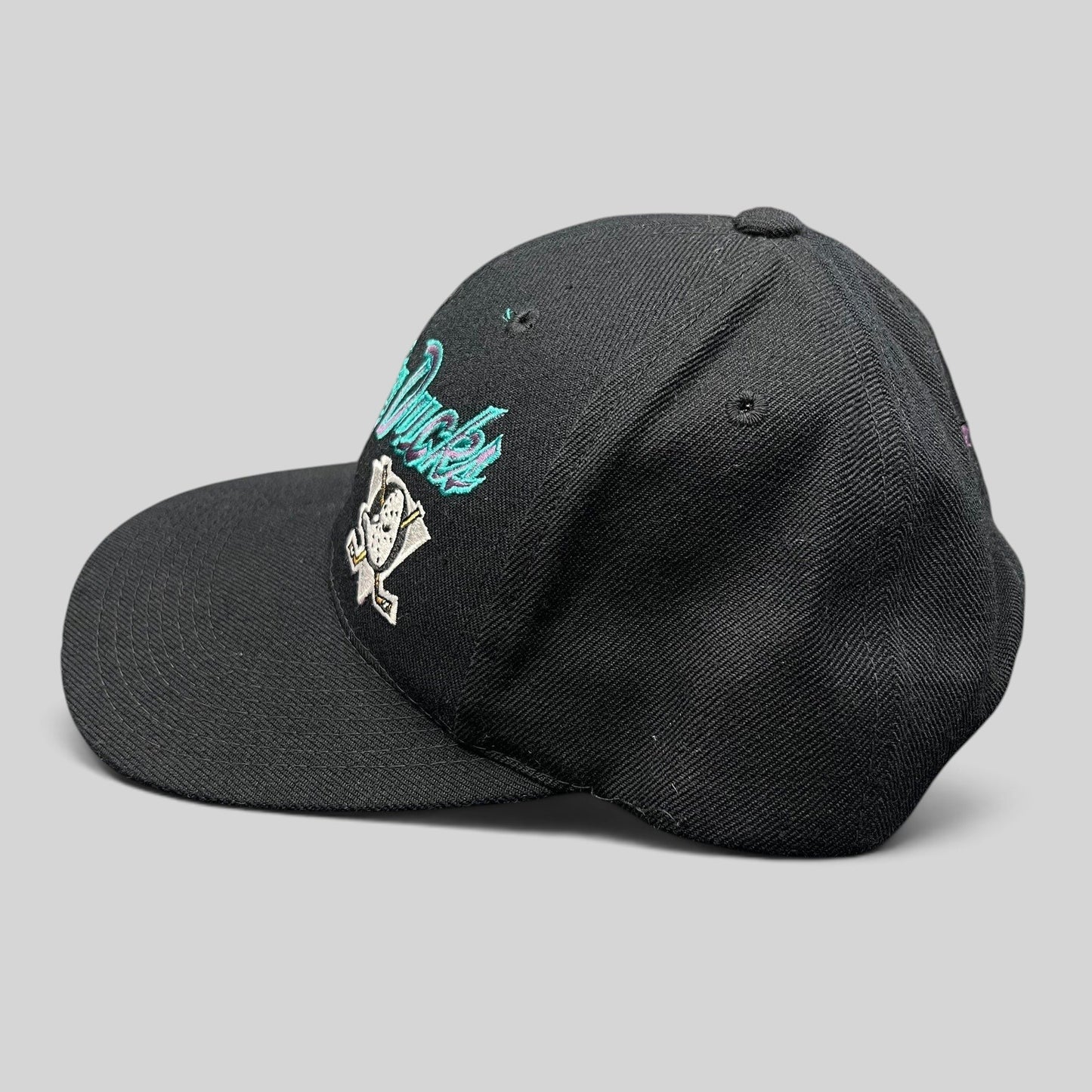 Raree Finds vintage Anaheim Mighty Ducks snapback hat in black with teal and purple script logo and Wild Wing mask