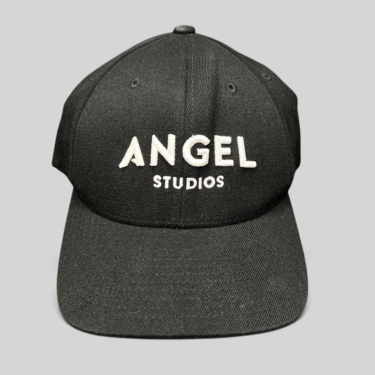 Raree Finds black Flexfit cap with white embroidered Angel Studios logo and structured curved brim