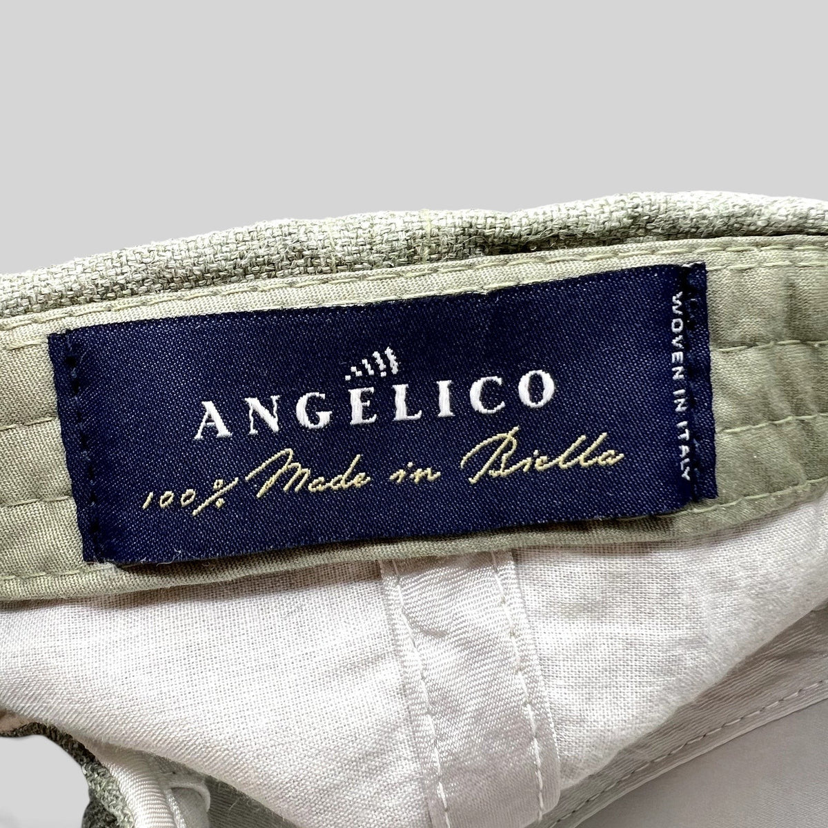 Raree Finds Angelico sage green linen cap interior label showing 100% Made in Biella Italian craftsmanship