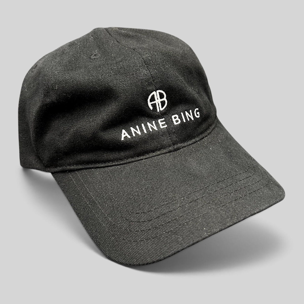 Raree Finds black cotton Anine Bing Sport dad cap with white embroidered AB monogram and logo on the front