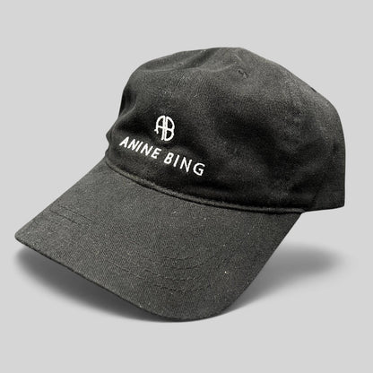 Raree Finds black cotton Anine Bing Sport dad cap with white embroidered AB monogram and logo on the front.