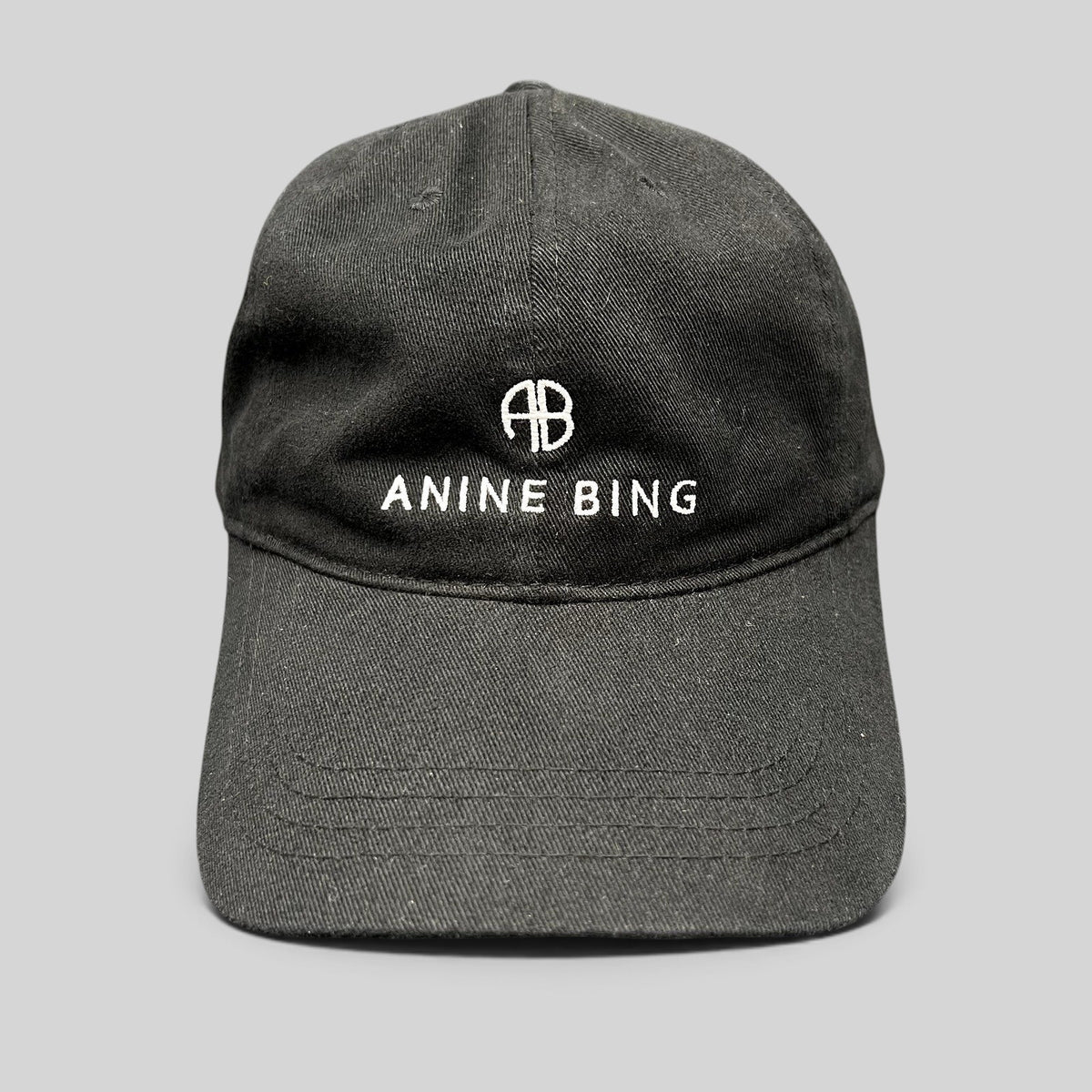 Raree Finds black 100% cotton Anine Bing Sport dad cap with white embroidered AB monogram and logo on the front