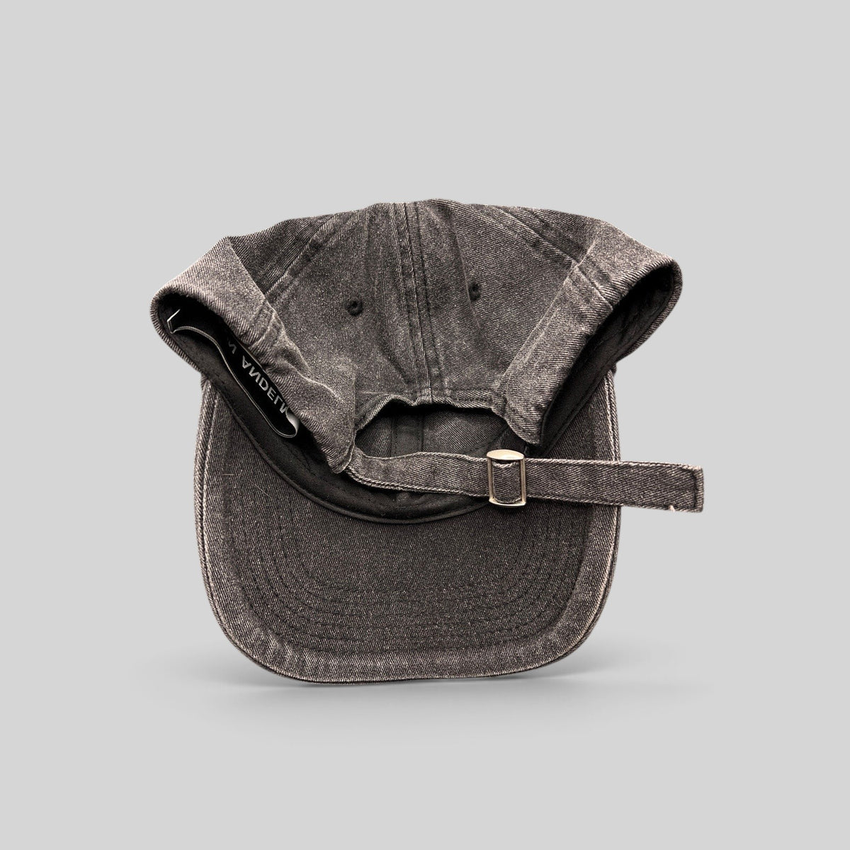 Raree Finds Ann Andelman washed black denim baseball cap with adjustable metal slide buckle and distressed brim detail.