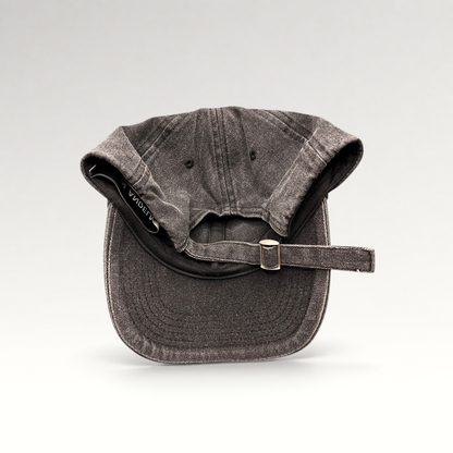 Raree Finds Ann Andelman washed black denim baseball cap with adjustable metal slide buckle and distressed brim detail.