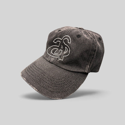 Raree Finds Ann Andelman black denim baseball cap with white embroidered monogram logo and distressed brim detail.