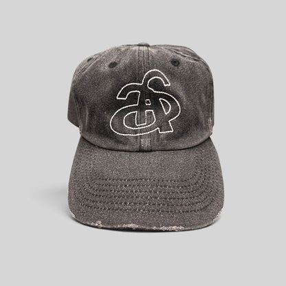 Raree Finds Ann Andelman distressed black denim baseball cap with white embroidered monogram logo on front