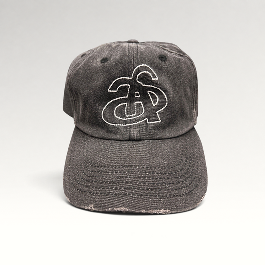 Raree Finds Ann Andelman distressed black denim baseball cap with white embroidered monogram logo on front