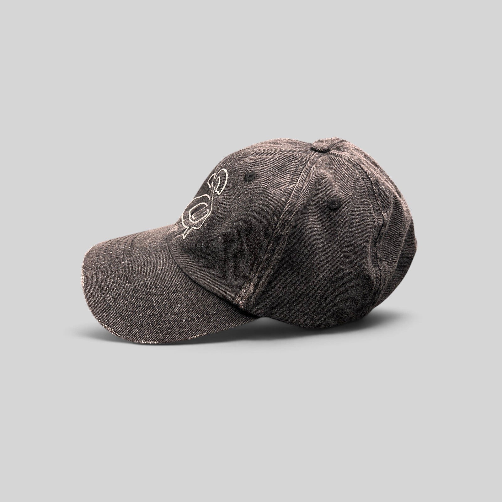 Raree Finds Ann Andelman distressed black denim baseball cap with white embroidered monogram logo and frayed brim
