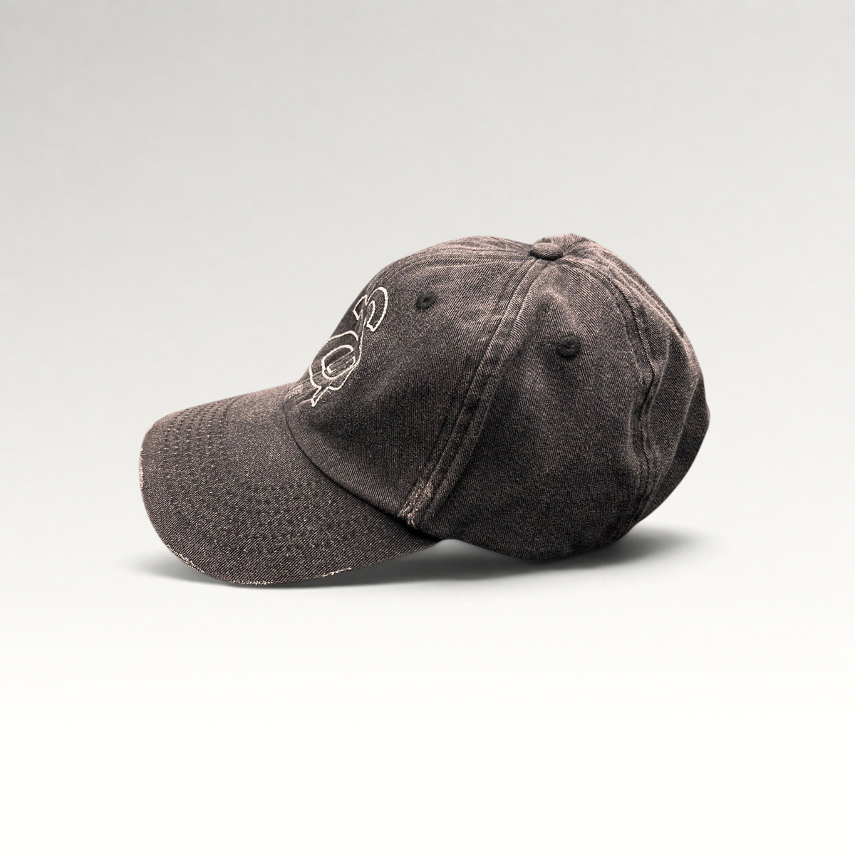 Raree Finds Ann Andelman distressed black denim baseball cap with white embroidered monogram logo and frayed brim