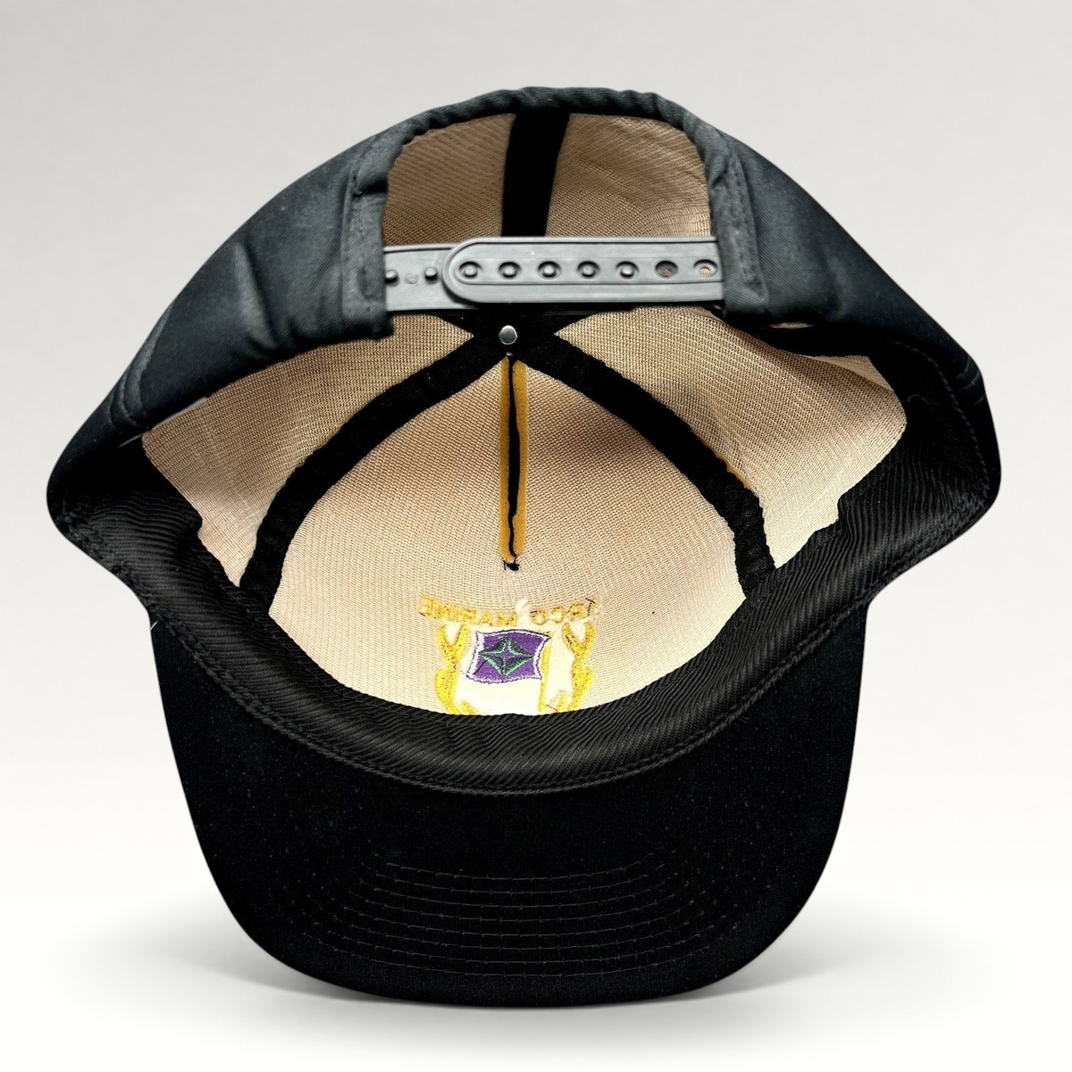 Raree Finds vintage ARCO Marine snapback hat interior view showing the adjustable plastic snap closure and foam lining