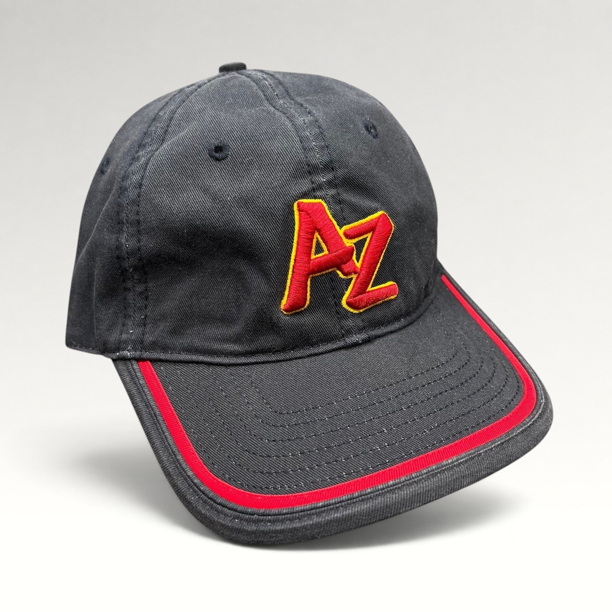 Raree Finds Arizona Iced Tea black strapback hat with raised red and yellow AZ logo embroidery and red brim piping.