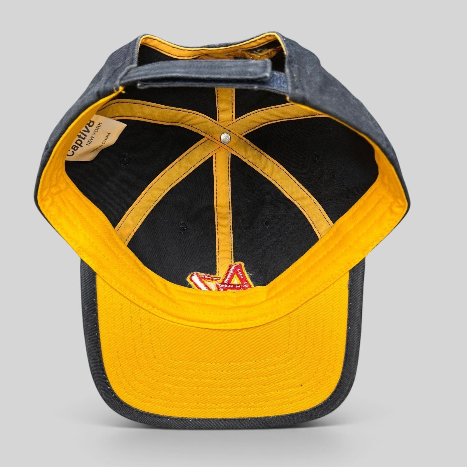 Raree Finds Arizona Iced Tea black strapback cap interior view showing yellow lining and AZ logo embroidery