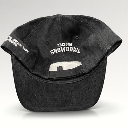 Raree Finds black Yupoong strapback hat featuring Arizona Snowbowl embroidery on the back and Humphreys Peak text.