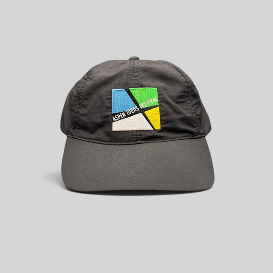 Raree Finds black unstructured strapback hat with embroidered Aspen Ideas Festival logo on the front panel.