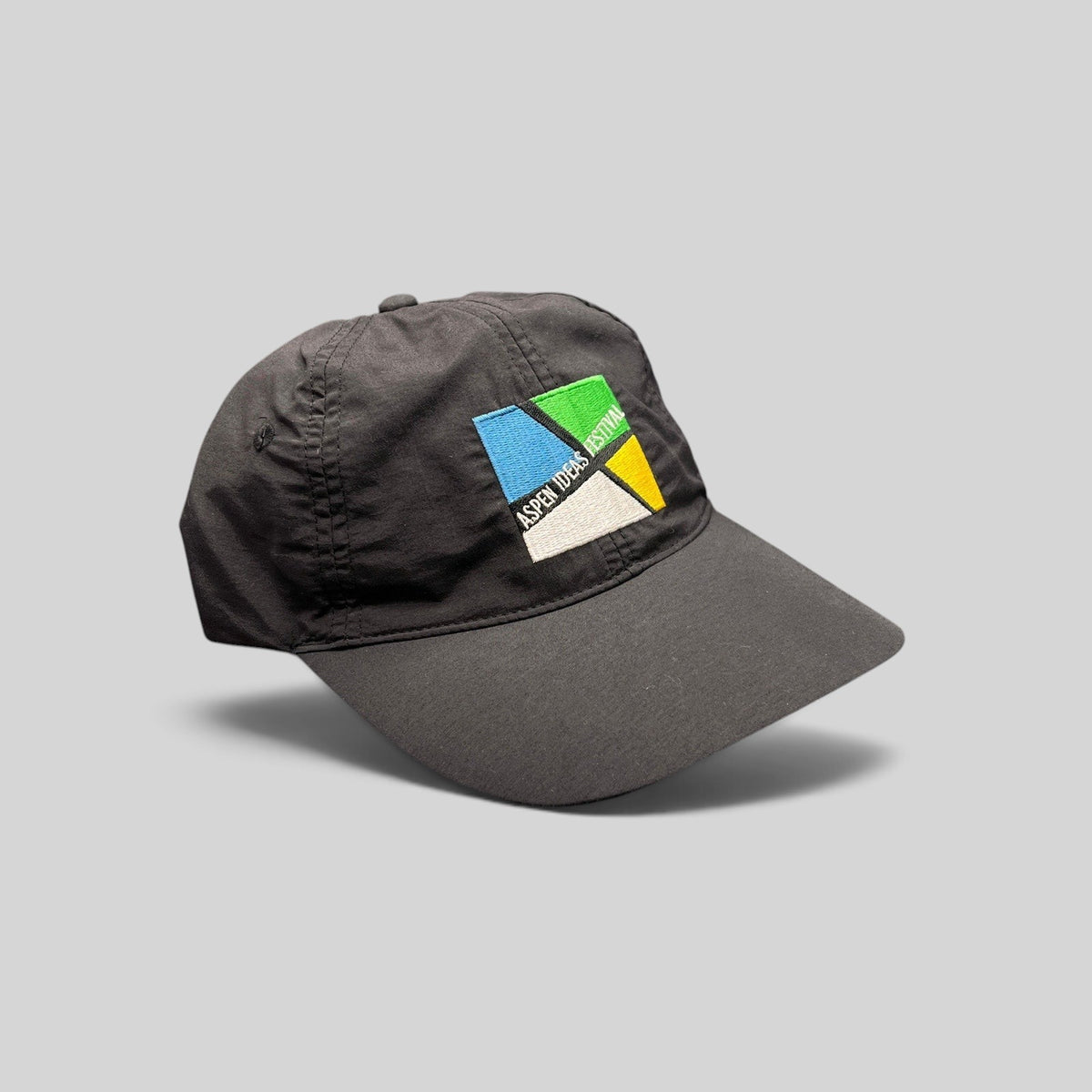 Raree Finds black unstructured strapback hat with colorful Aspen Ideas Festival logo embroidery on the front panel.