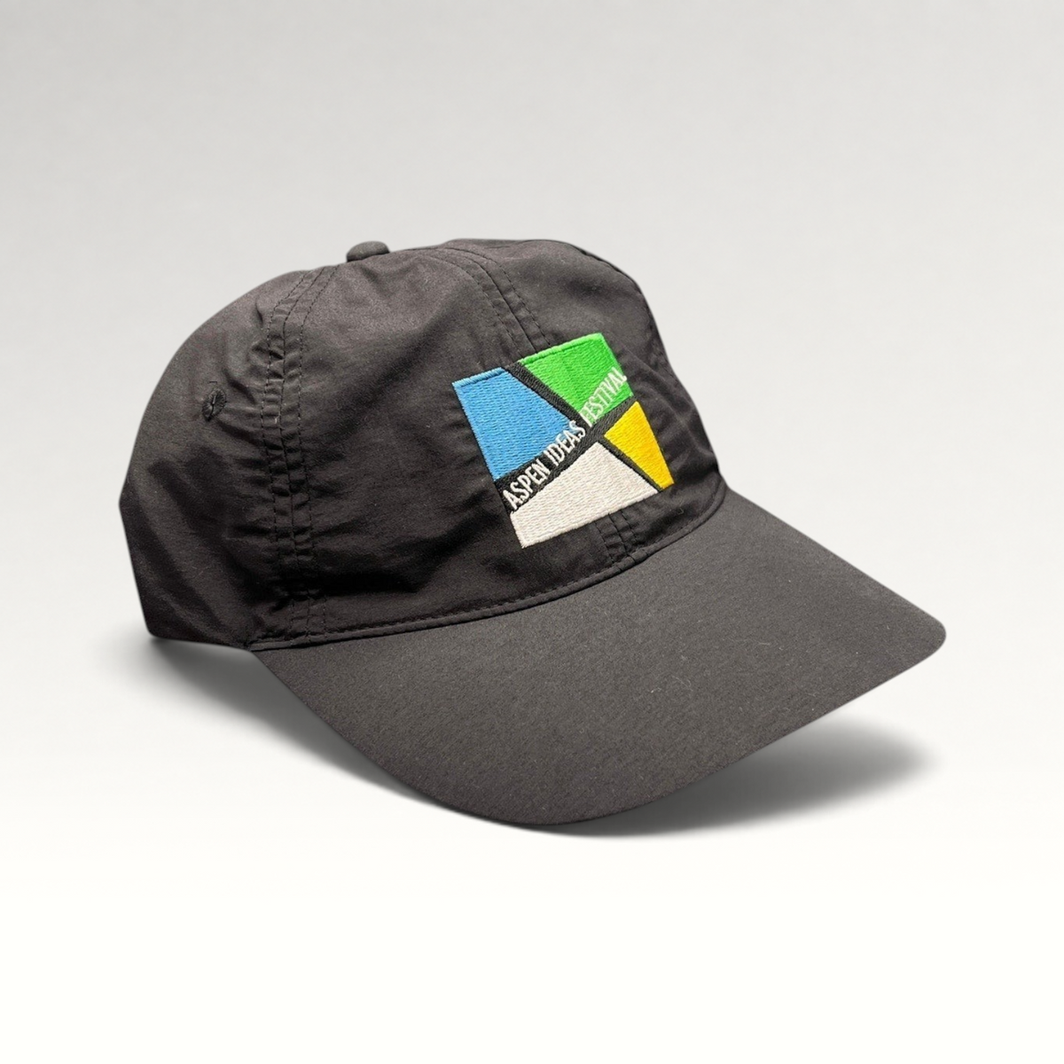 Raree Finds black unstructured strapback hat with colorful Aspen Ideas Festival logo embroidery on the front panel.