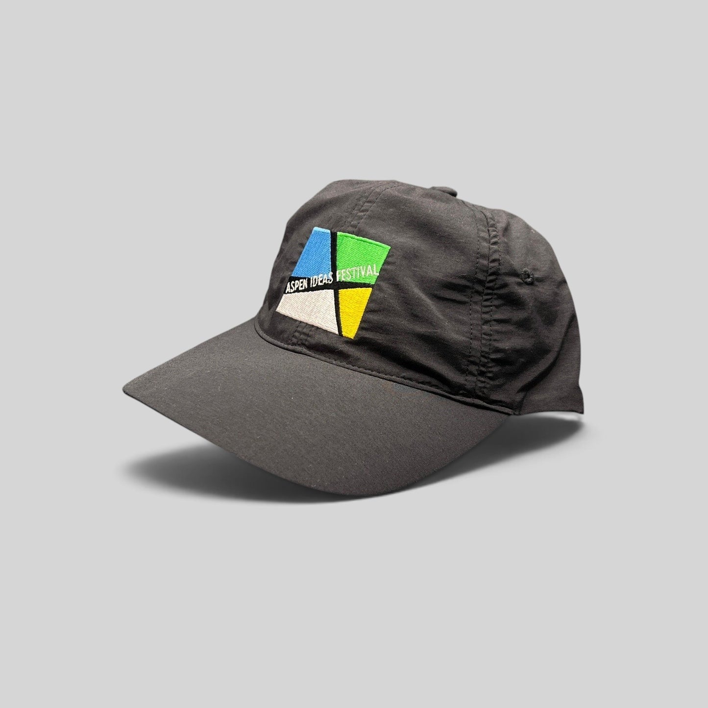 Raree Finds black unstructured strapback hat with embroidered multicolor Aspen Ideas Festival logo on front panel