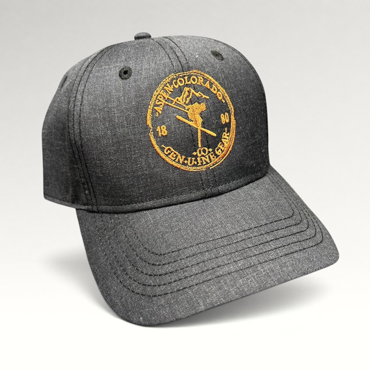 Raree Finds vintage black Aspen Colorado ski strapback hat with copper embroidered mountain and skier logo.