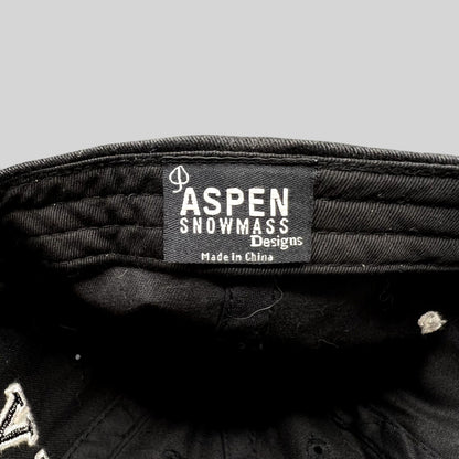 Raree Finds black cotton Aspen Snowmass Designs hat interior label with white embroidered text
