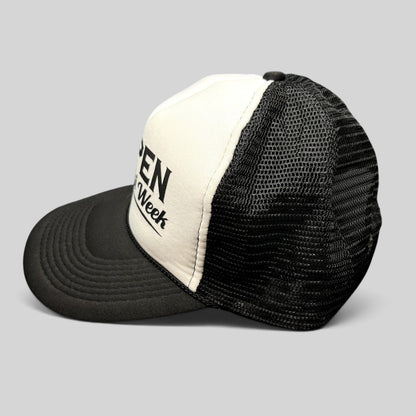 Raree Finds vintage Otto trucker hat in black and white with Aspen Gay Ski Week script on a foam front and mesh back.