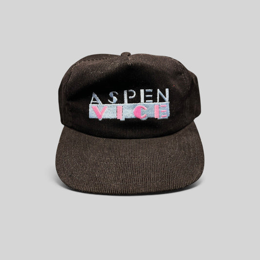 Raree Finds vintage 1980s black wide-wale corduroy snapback hat with pastel Aspen Vice embroidery, made in the USA.