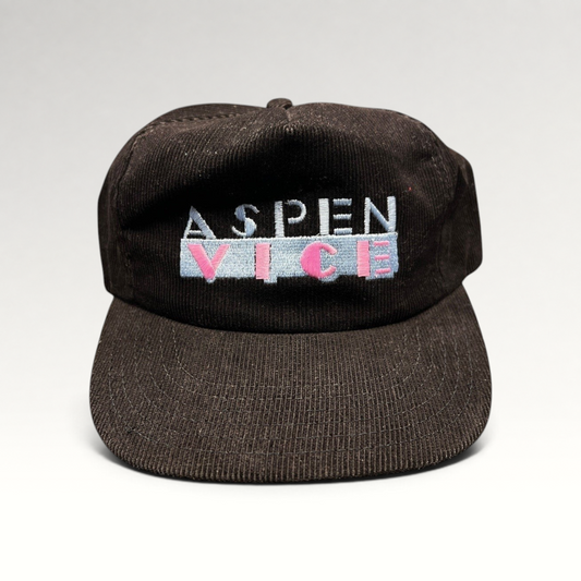 Raree Finds vintage 1980s black wide-wale corduroy snapback hat with pastel Aspen Vice embroidery, made in the USA.