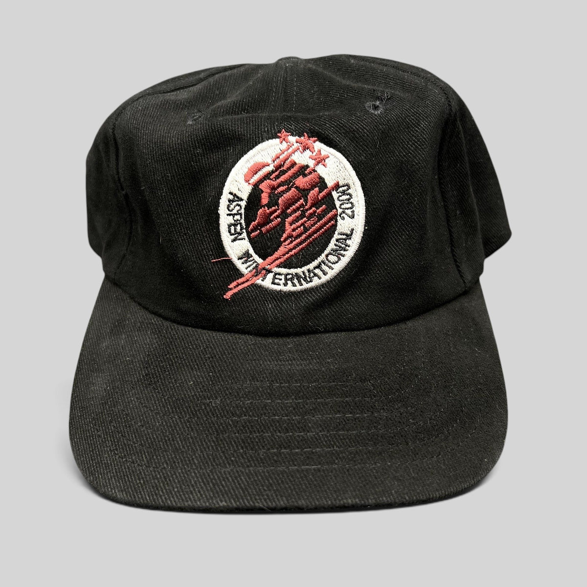 Raree Finds vintage black cotton strapback hat with embroidered Aspen Winternational 2000 skier logo in red and white