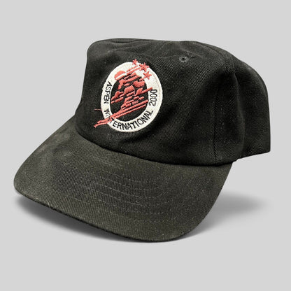 Raree Finds vintage black cotton strapback hat with Aspen Winternational 2000 skier embroidery and Chevy branding.