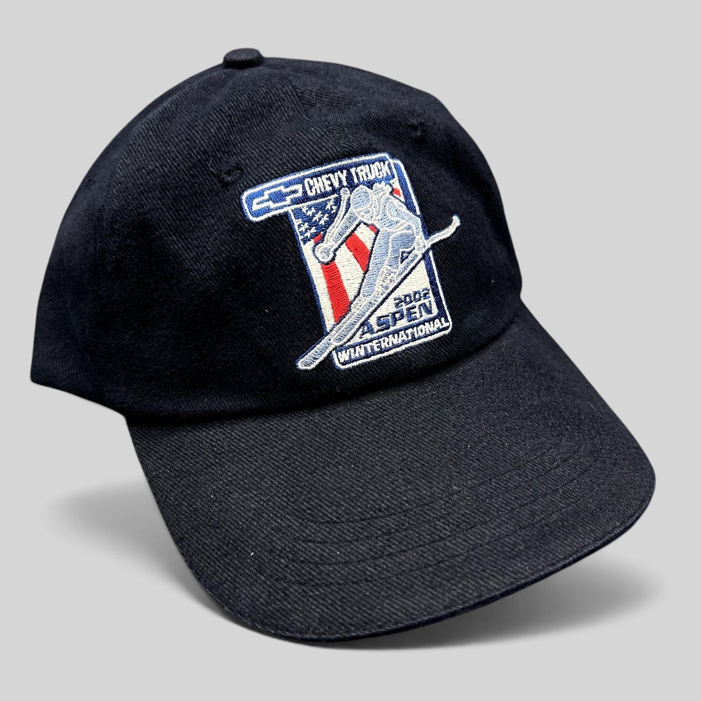 Raree Finds navy blue 2002 Aspen Winternational cotton strapback hat with Chevrolet Truck and skier embroidery.