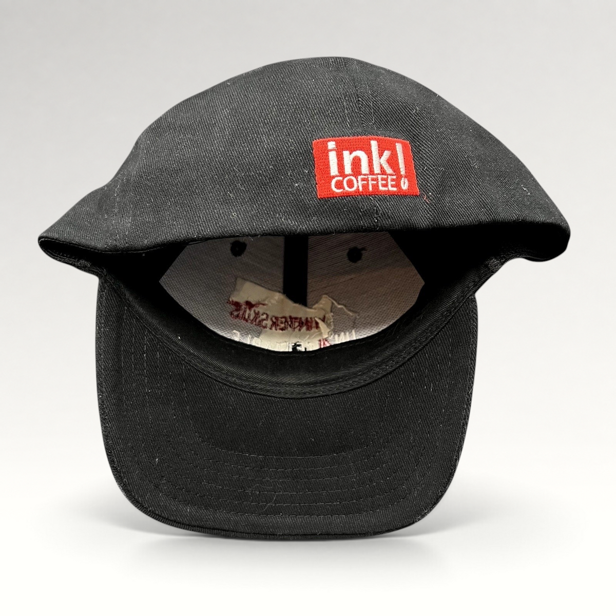 Raree Finds black 2004 Aspen Wintersköl stretch-fit hat with red Ink! Coffee logo embroidery on the side