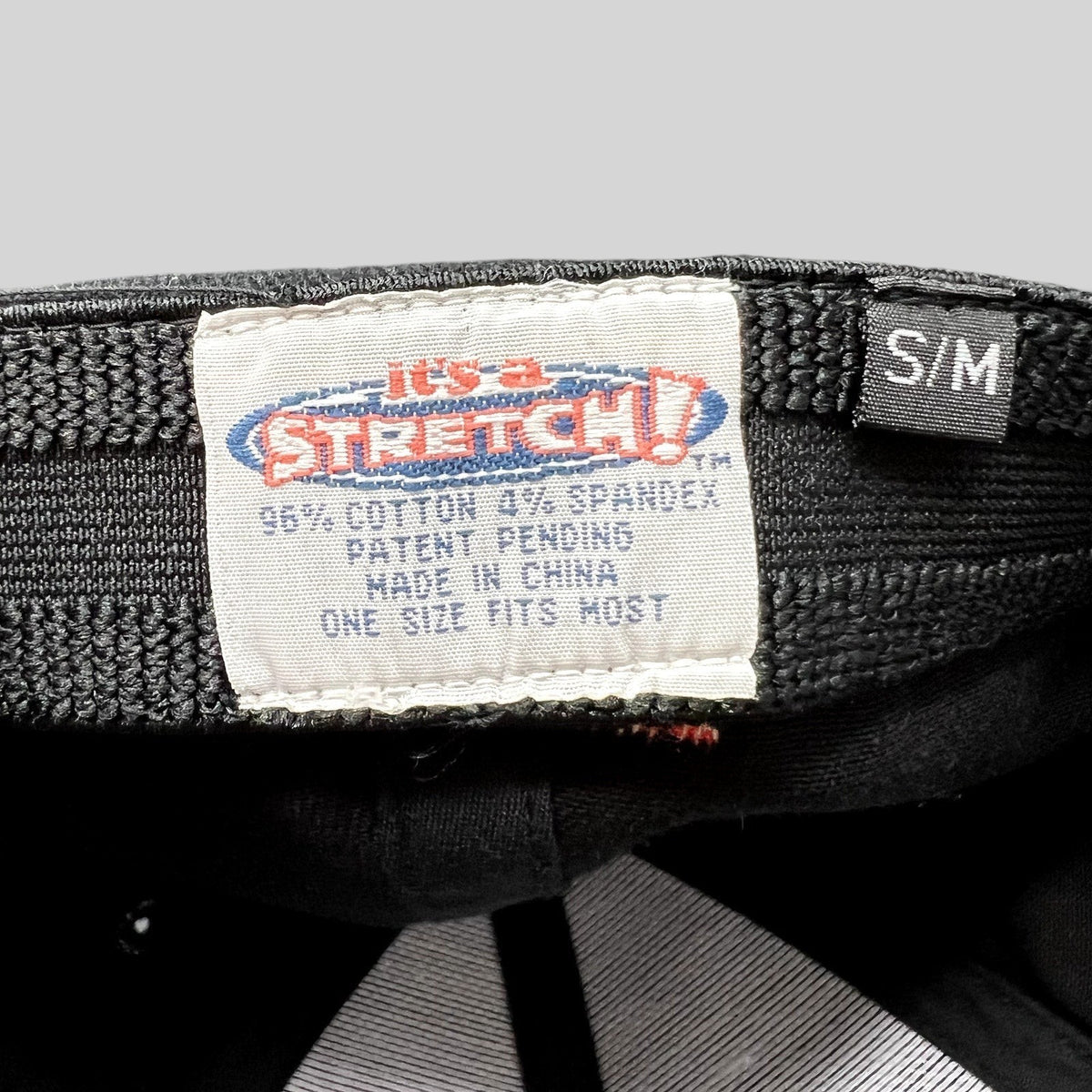 Raree Finds vintage 2004 Aspen Wintersköl hat interior label showing Stretch! cotton spandex material and S/M size tag