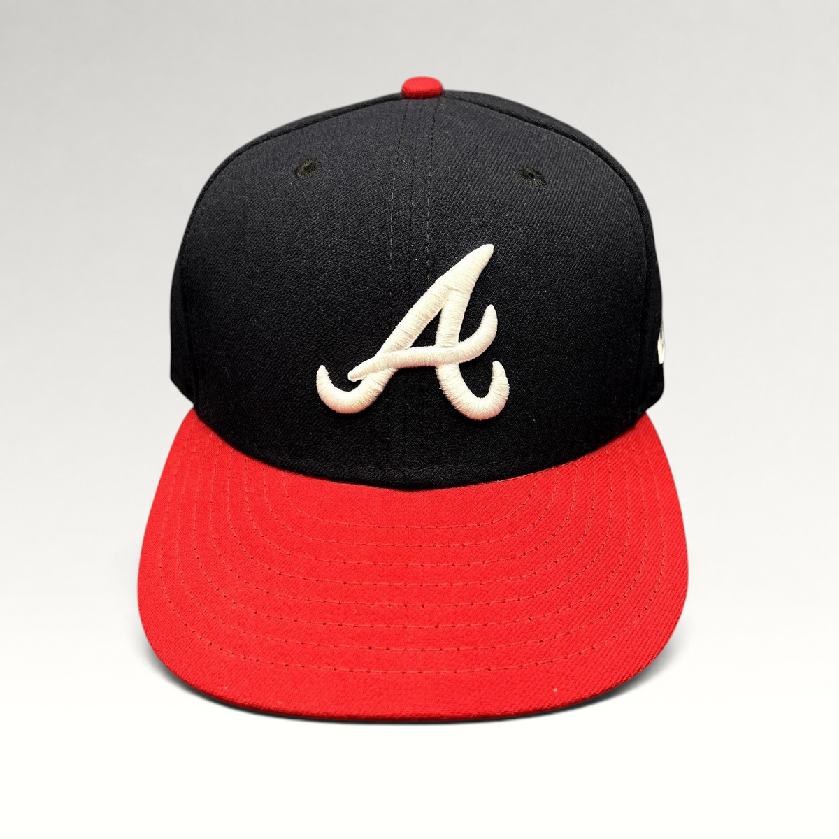 Raree Finds Atlanta Braves 59FIFTY fitted hat with navy crown, red flat brim, and white embroidered A logo
