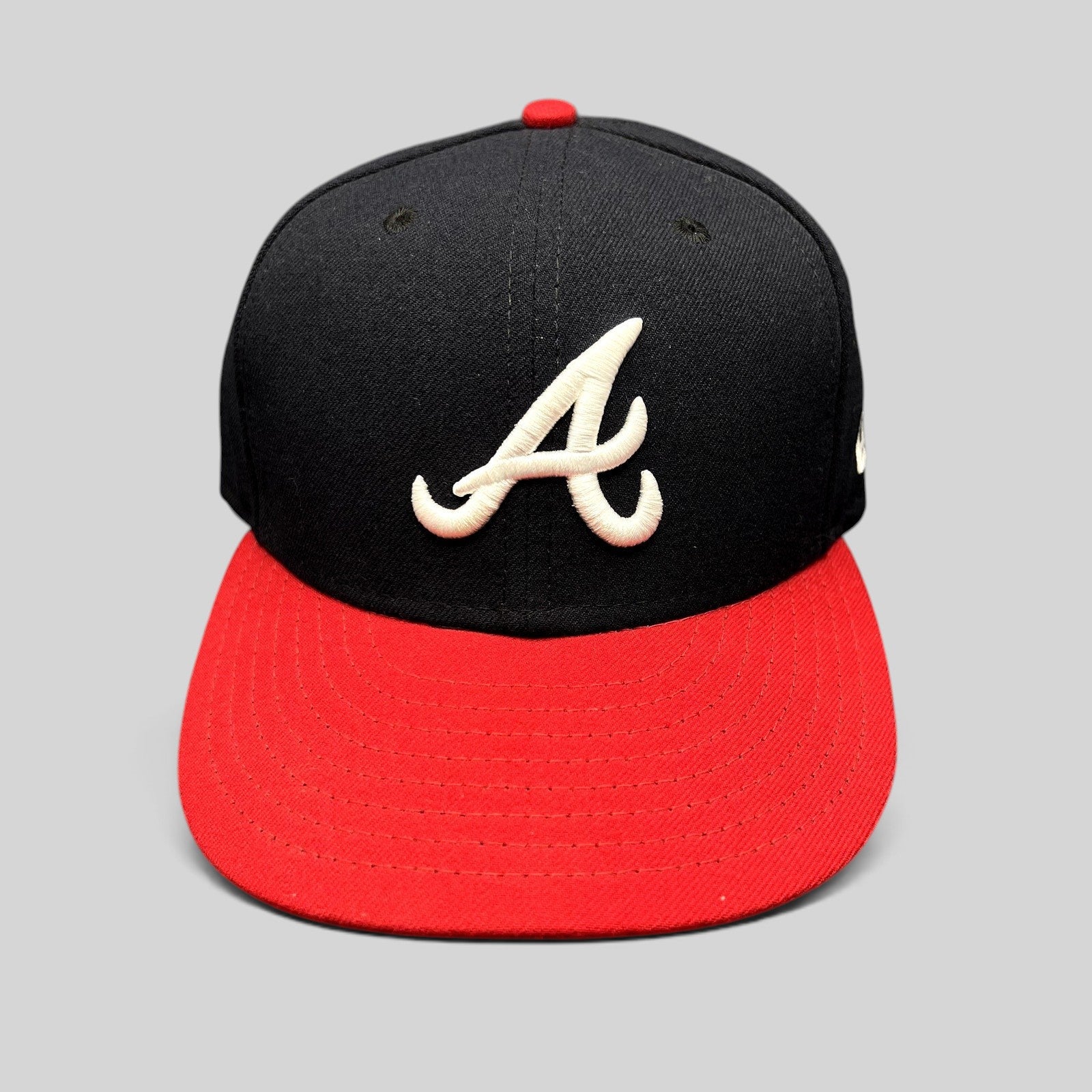 Raree Finds New Era 59FIFTY Atlanta Braves fitted hat with navy crown, red visor, and white embroidered A logo