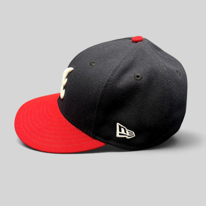 Raree Finds Atlanta Braves 59FIFTY fitted hat with navy crown, red flat brim, and embroidered logo side profile view
