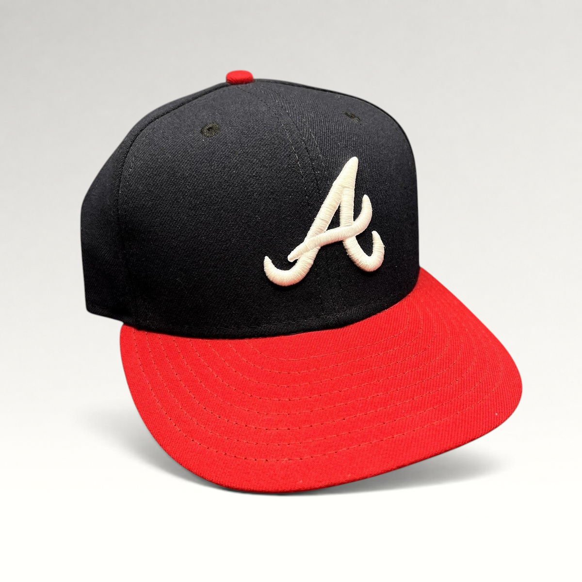 Raree Finds Atlanta Braves 59FIFTY fitted hat with navy crown, red flat brim, and white embroidered A logo