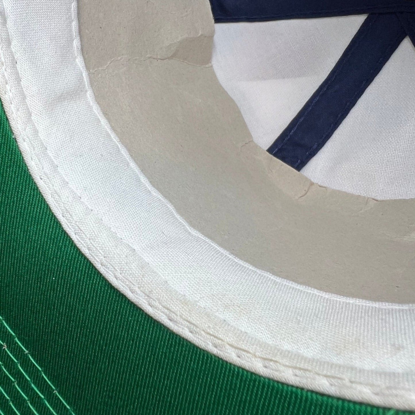 Raree Finds vintage 90s Atlanta Braves snapback hat interior showing green underbrim and clean white sweatband