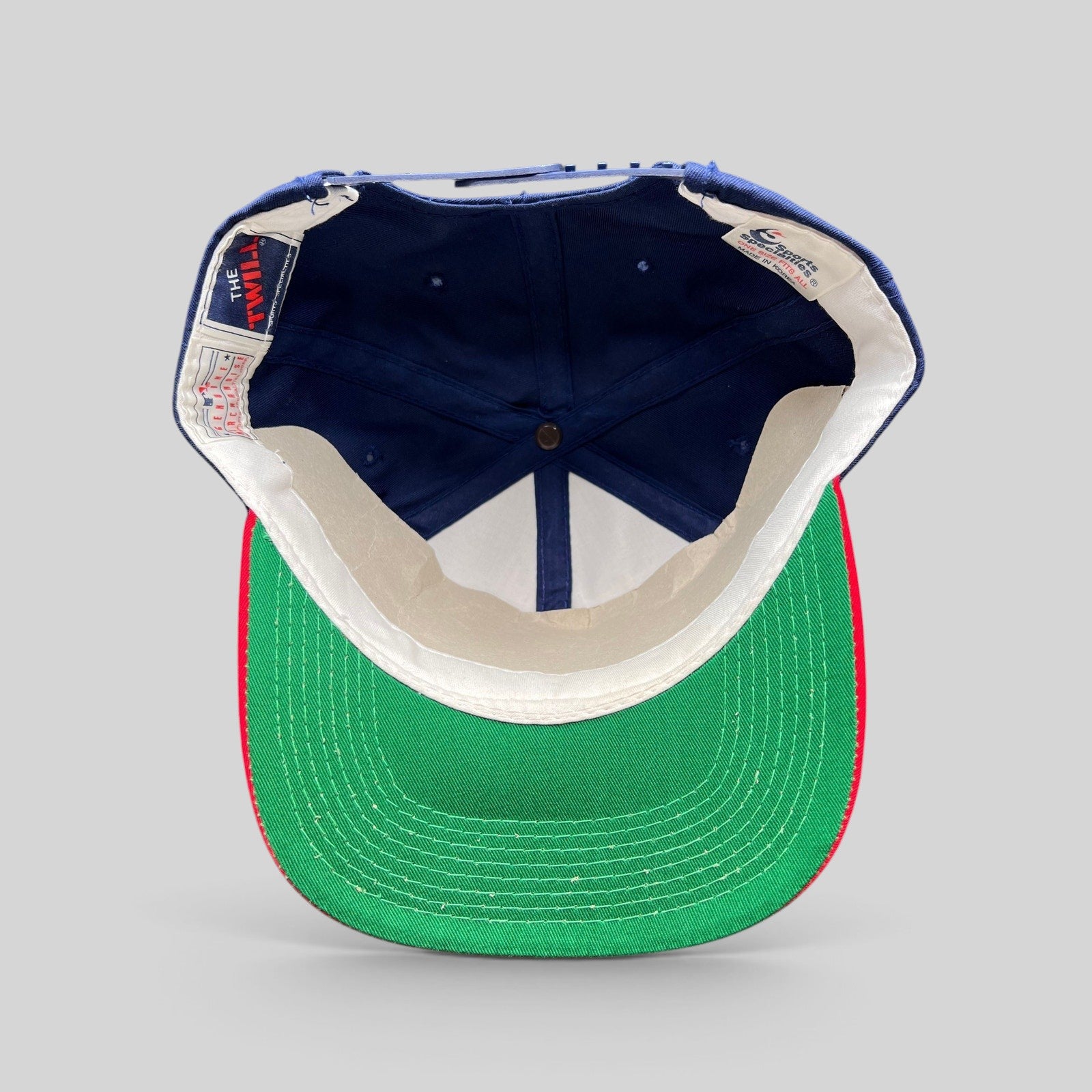 Raree Finds vintage 90s Sports Specialties Atlanta Braves snapback hat interior showing green underbrim and labels