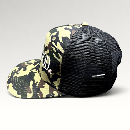 Raree Finds ATLWOOD woodland camo trucker hat with black mesh back, flat brim, and white front embroidery.
