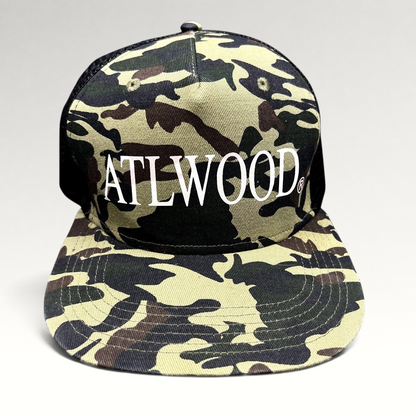 Raree Finds ATLWOOD woodland camo trucker hat with white front embroidery, black mesh back, and flat brim.
